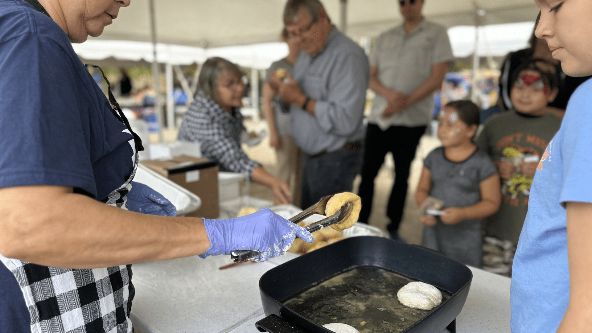 Pic of Glenna Cameron and family cooking scone