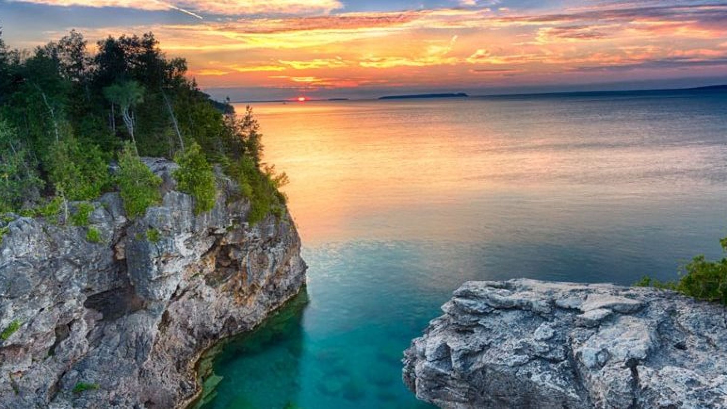 Cliff with water in background